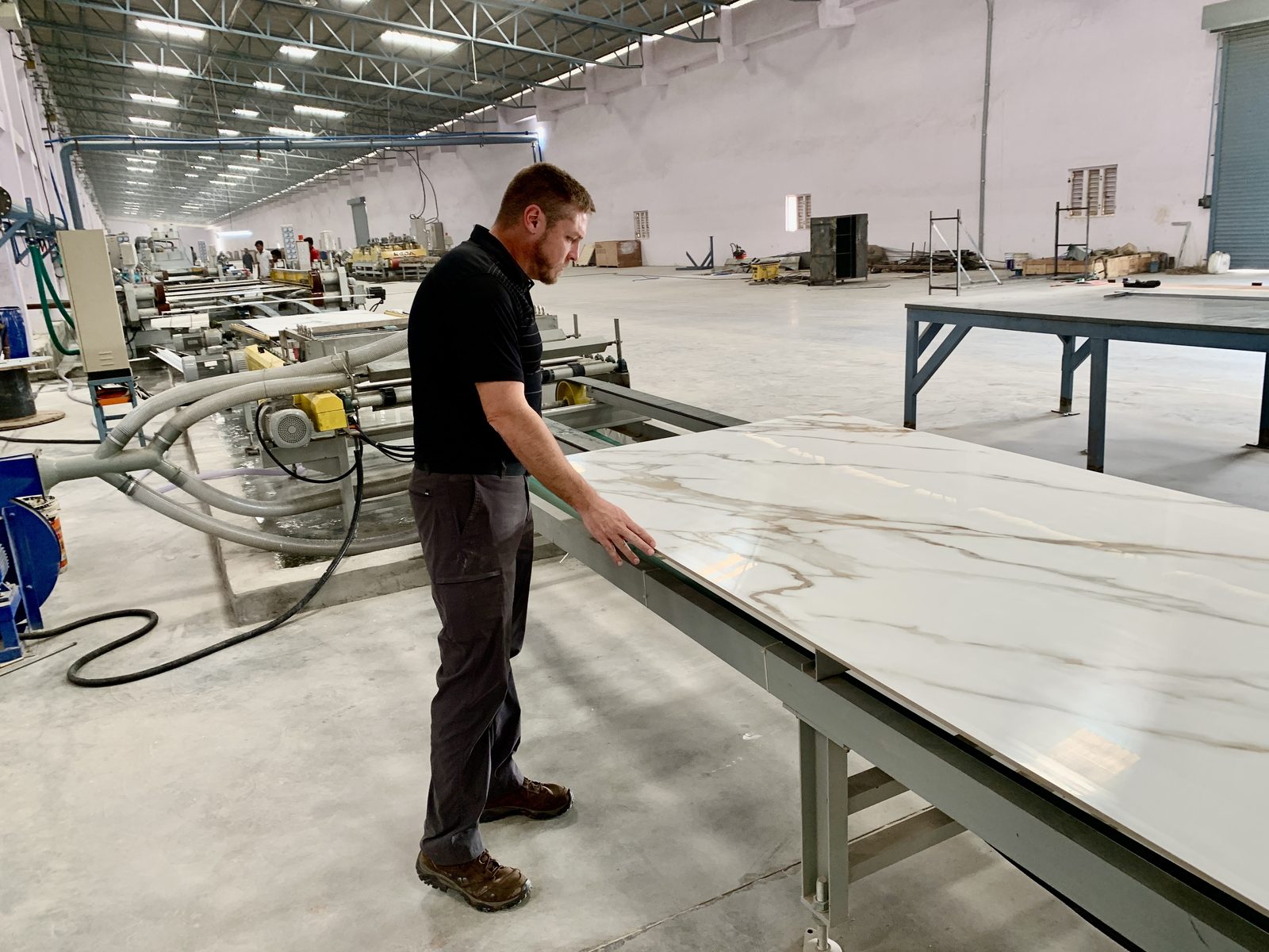 Inspecting porcelain tile slabs at factory